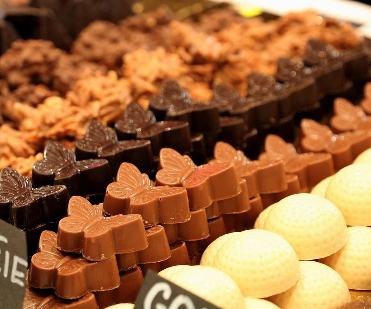 Shelves lined with colorful wrapped sweets and chocolate boxes